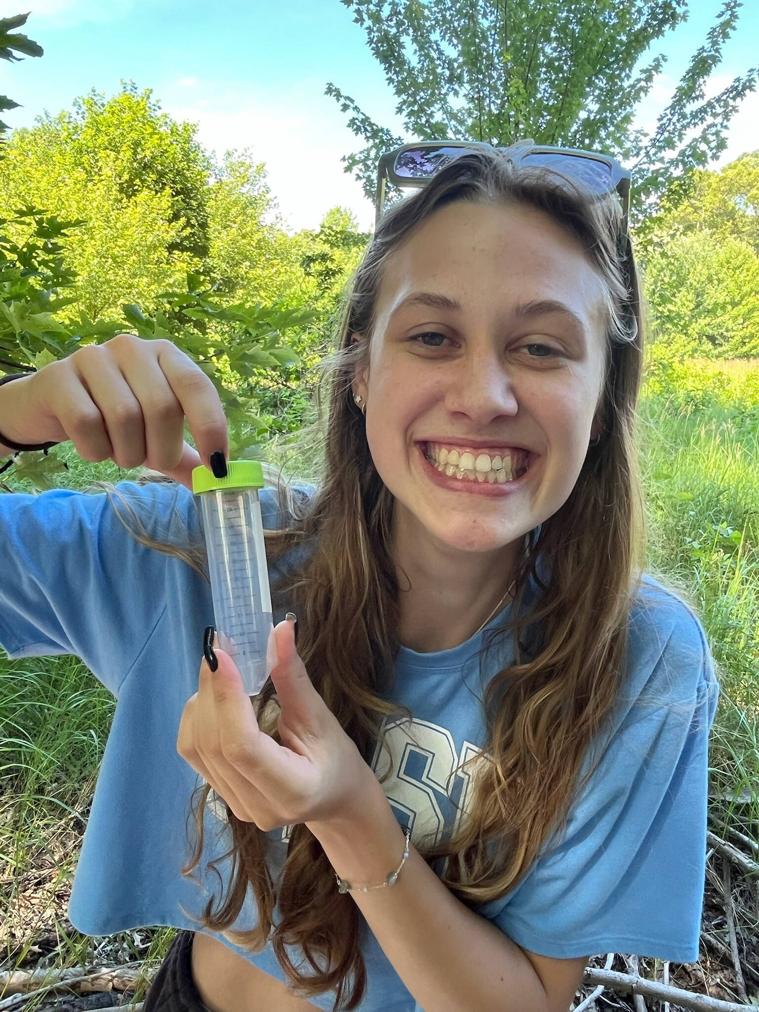 Student holding tick